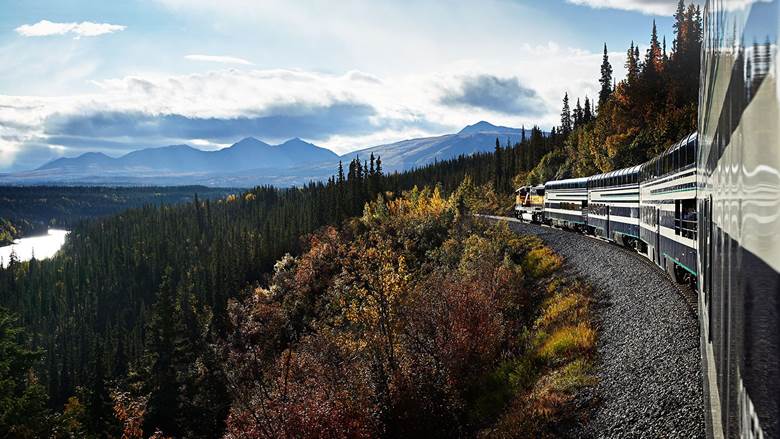 Train travelling through the Alaska wilderness 